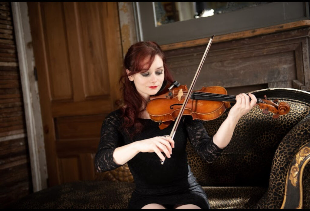 Red headed woman playing violin